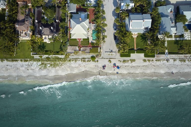 Wealthy waterfront residential area with luxury homes and seawalls