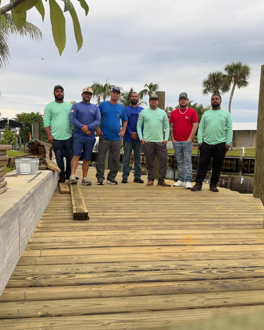 Harbor Bay Marine owner Scott Szafranski with his crew on a seawall job site